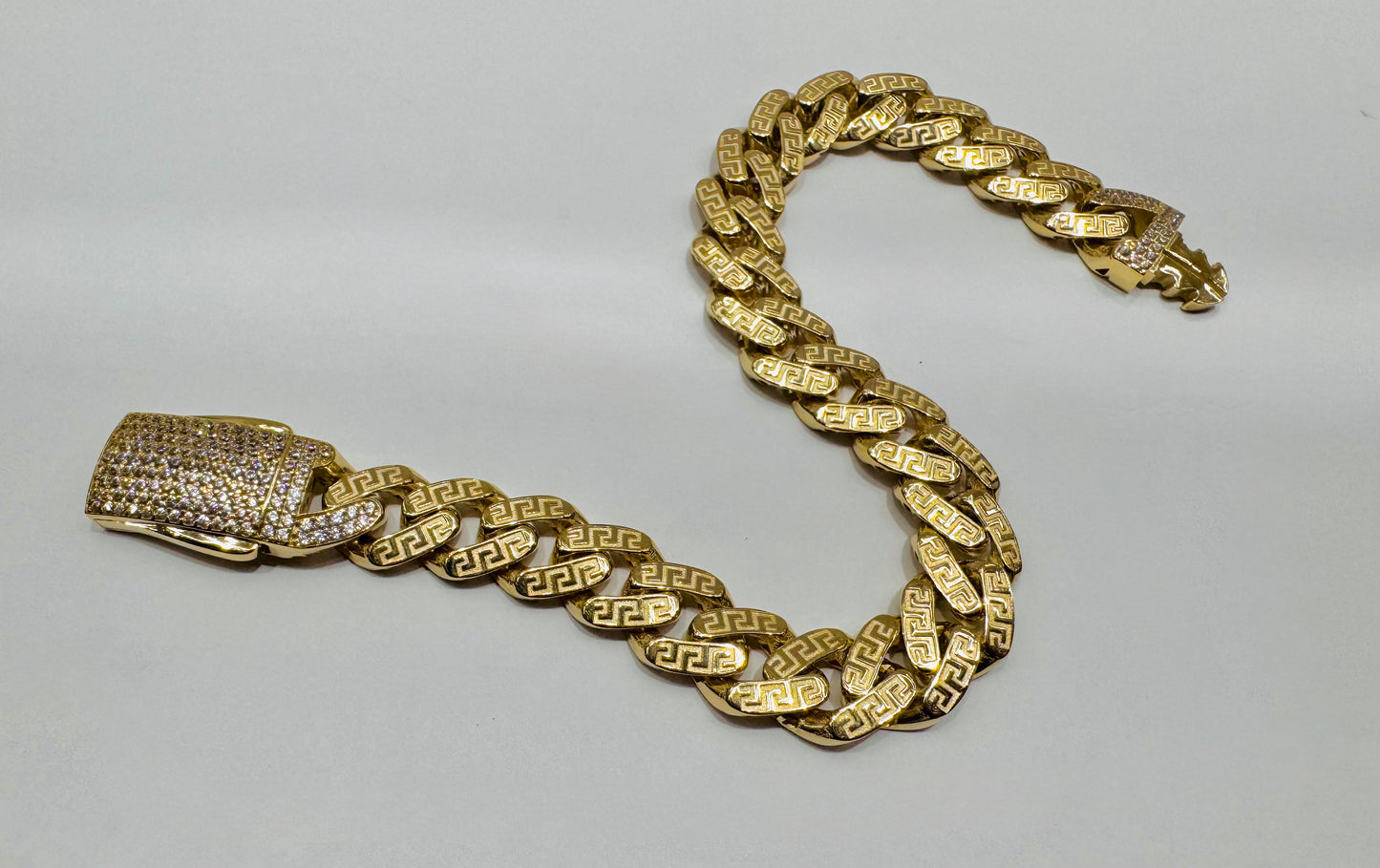 10K GOLD MONACO BRACELET WITH VERSACE BORDER DESIGN 9”, WIDTH: 10.4mm, WEIGHT: 14.3gm