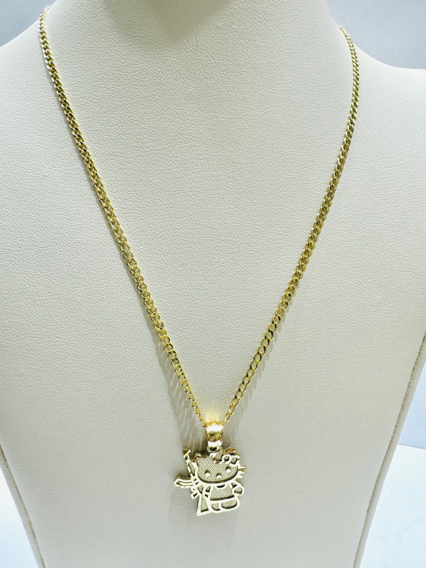 10K GOLD CUBAN LINK NECKLACE 18”, WEIGHT: 1.3gm, WIDTH: 1.99mm WITH SMALL HELLO KITTY GUN PENDANT, WEIGHT: 1.8gm