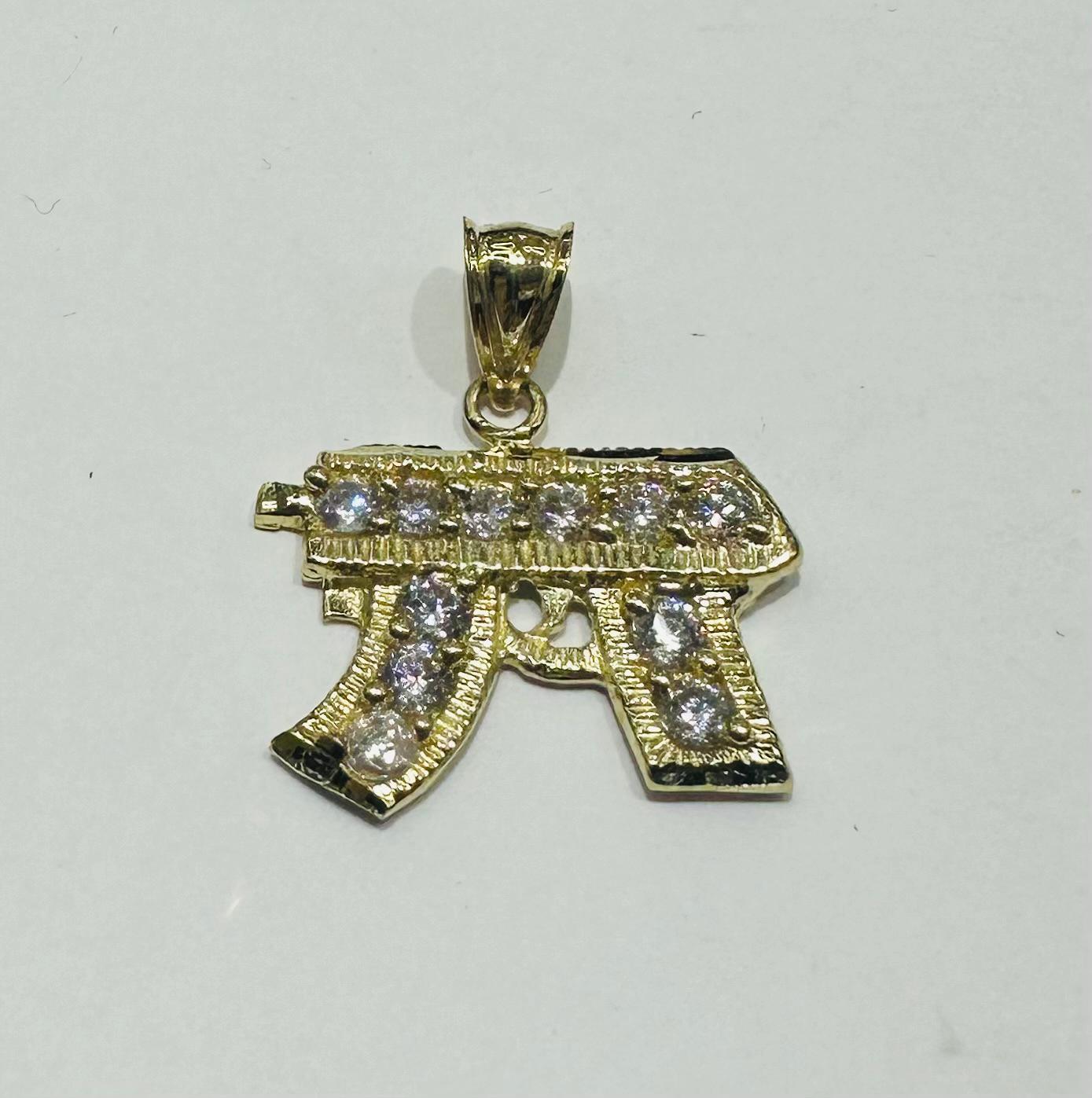 10K GOLD CZ GUN PENDANT, WEIGHT: 2.2gm