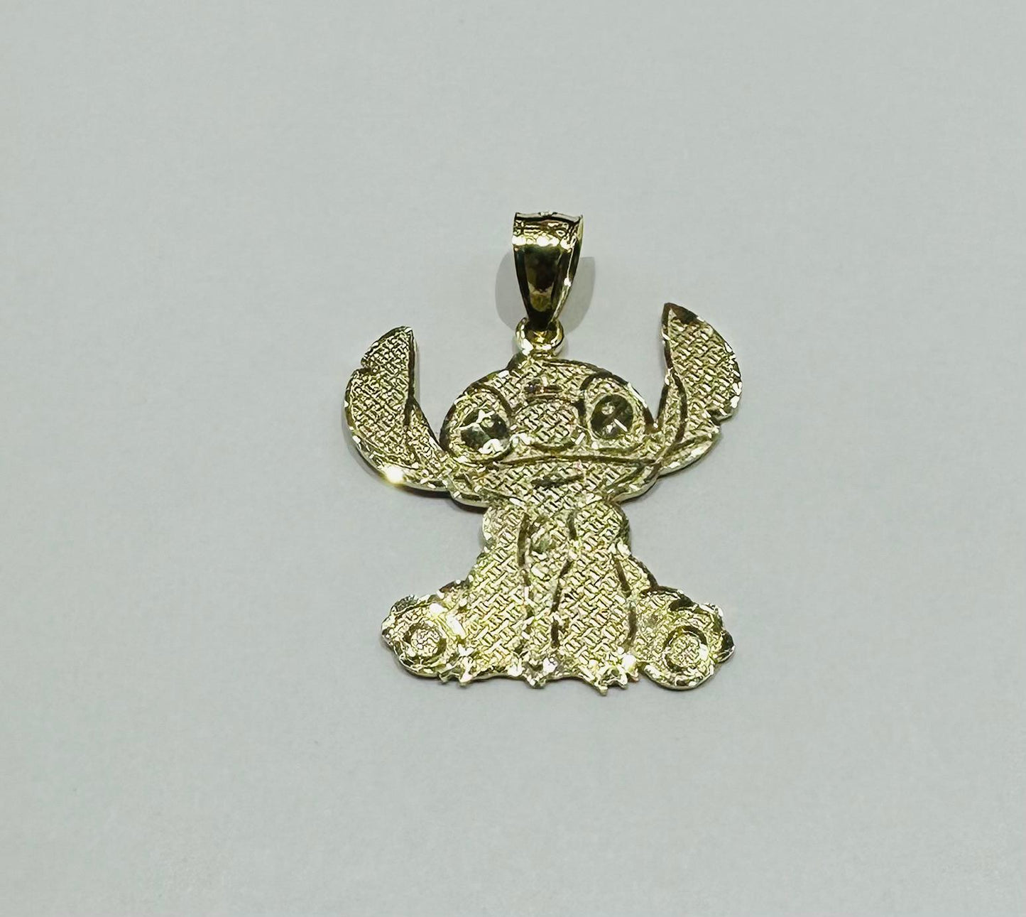 10K GOLD SMALL STICH PENDANT, WEIGHT: 1.8gm