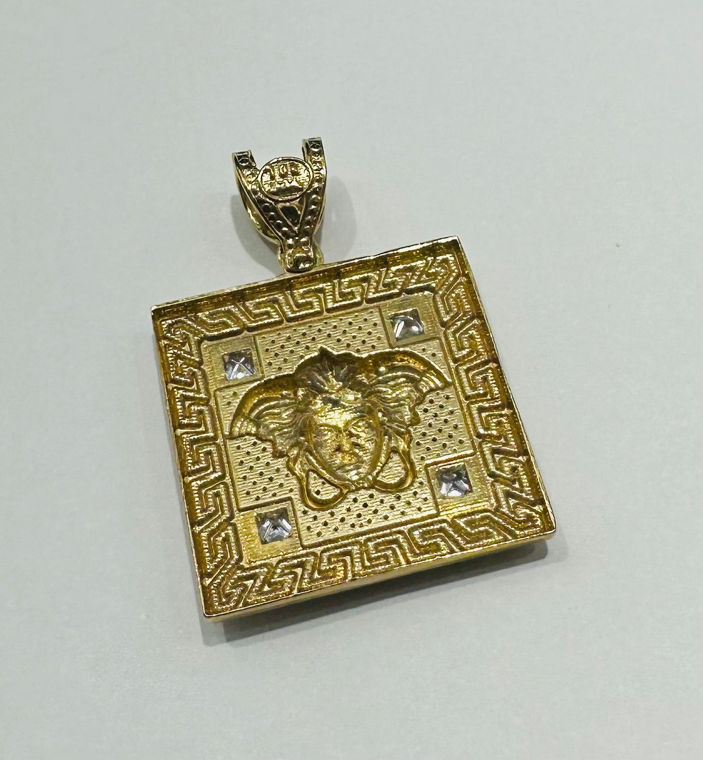 10K GOLD MEDUSA HEAD PENDANT WITH WHITE SAPPHIRE- WEIGHT: 5.4gm