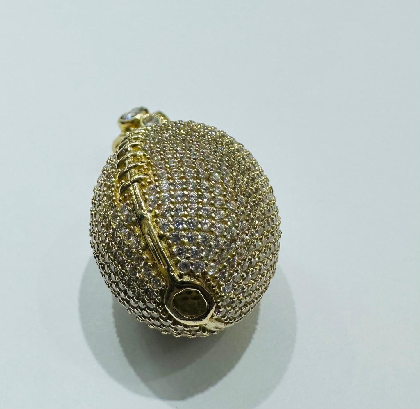10K GOLD FOOTBALL PENDANT WITH WHITE SAPPHIRE- WEIGHT: 15.3gm