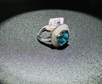 SILVER RING WITH BLUE TOPAZ AND WHITE SWAROVSKI STONES, SIZE: 7, WEIGHT: 5.4gm