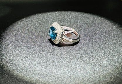 SILVER RING WITH BLUE TOPAZ AND WHITE SWAROVSKI STONES, SIZE: 7, WEIGHT: 5.4gm