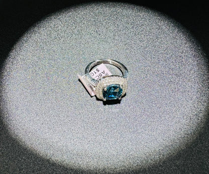 SILVER RING WITH BLUE TOPAZ AND WHITE SWAROVSKI STONES, SIZE: 7, WEIGHT: 5.4gm