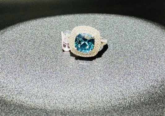 SILVER RING WITH BLUE TOPAZ AND WHITE SWAROVSKI STONES, SIZE: 7, WEIGHT: 5.4gm