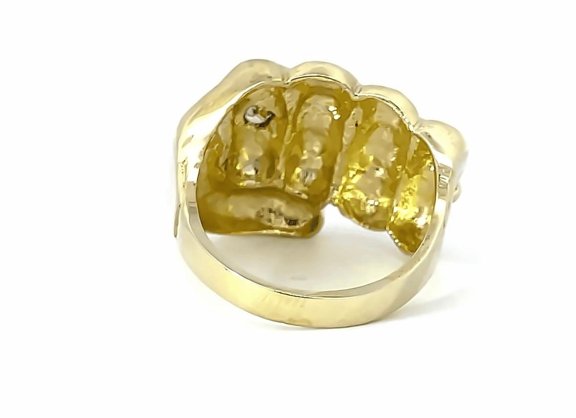 10K GOLD FIST RING- Weight: 10.5gm