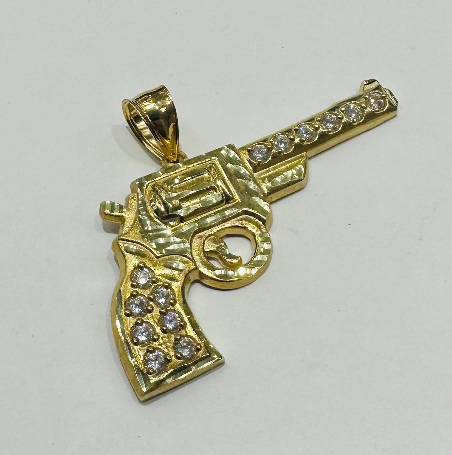 10K GOLD CZ GUN PENDANT, WEIGHT: 9.3gm