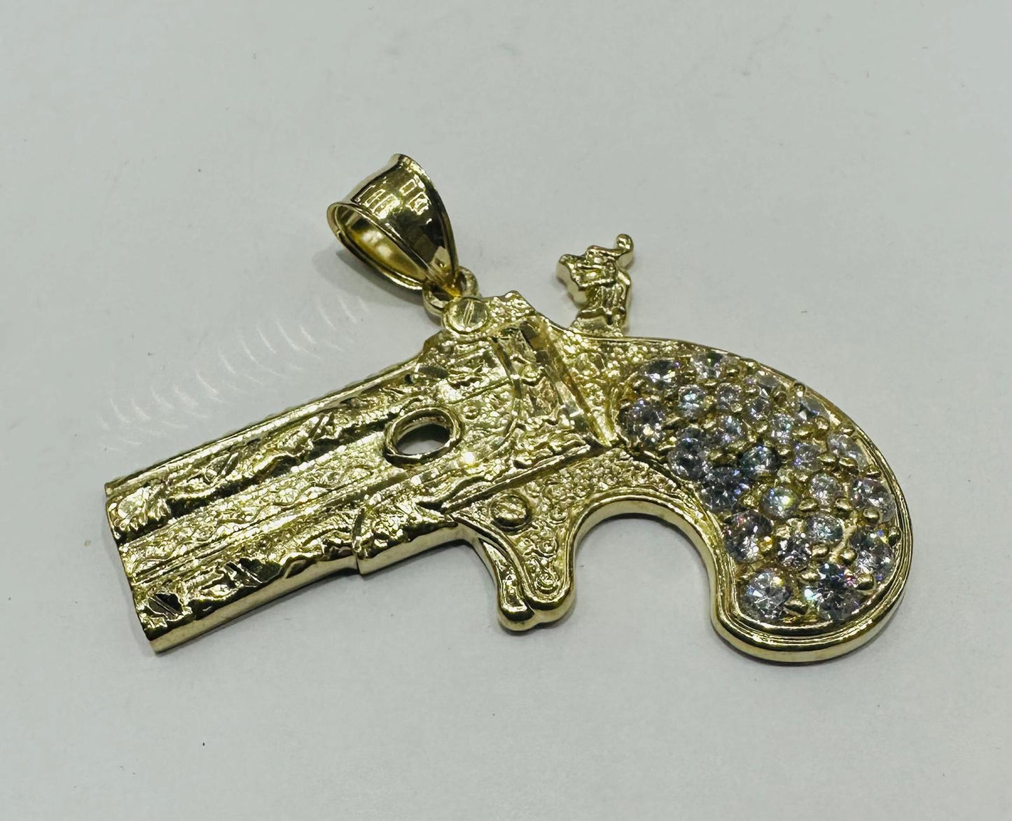 10K GOLD CZ GUN PENDANT, WEIGHT: 12.5gm