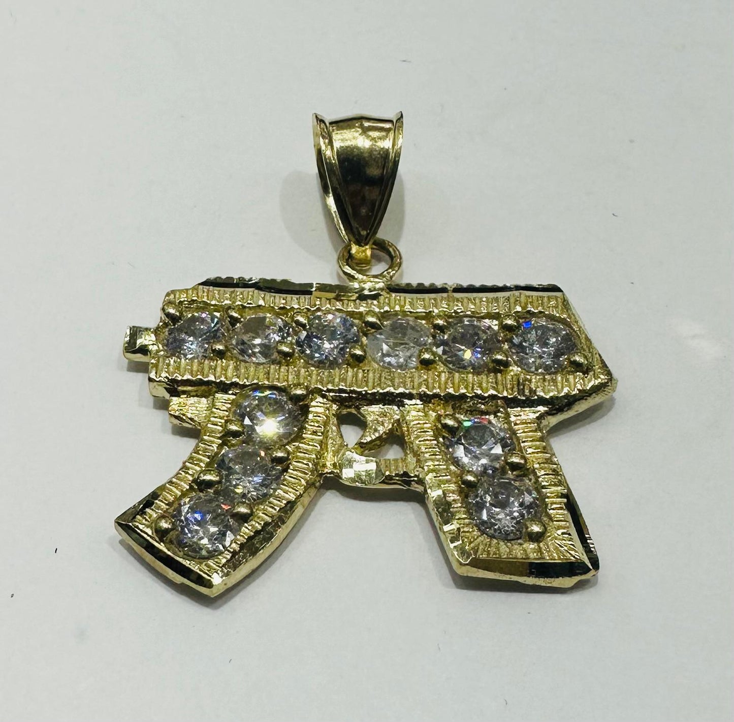 10K GOLD CZ GUN PENDANT, WEIGHT: 4.4gm