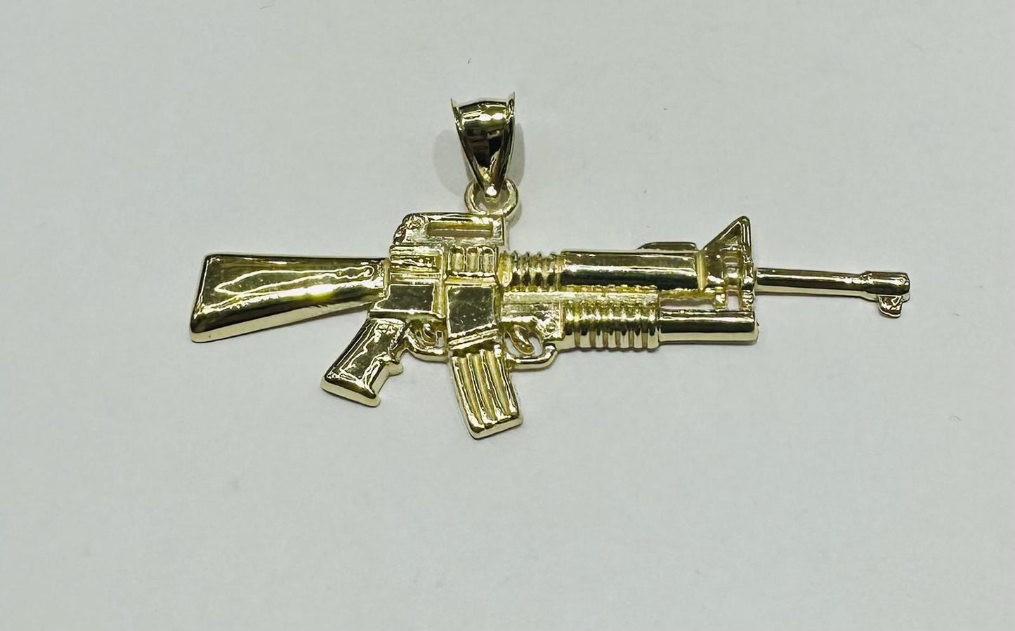 10K GOLD GUN PENDANT, WEIGHT: 3.6gm
