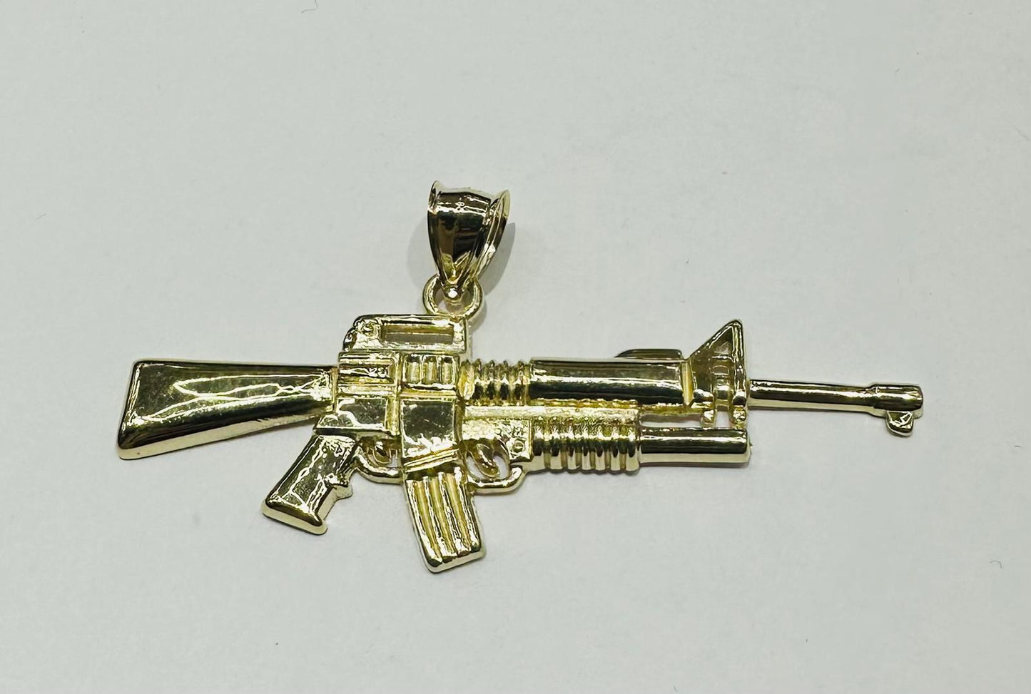 10K GOLD GUN PENDANT, WEIGHT: 3.6gm