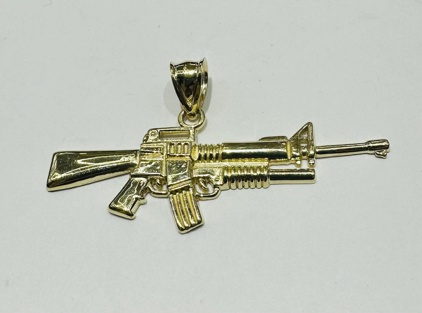 10K GOLD GUN PENDANT, WEIGHT: 2.1gm