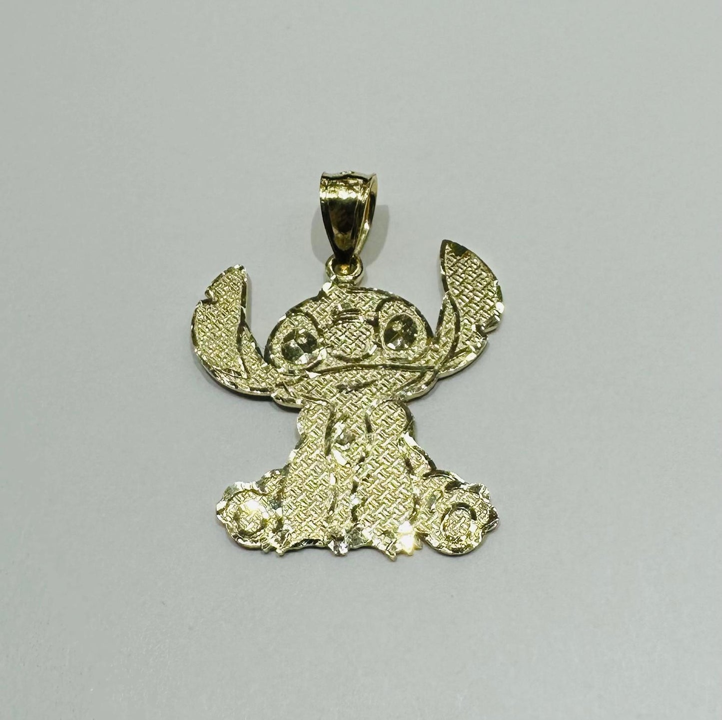 10K GOLD SMALL STICH PENDANT,  WEIGHT: 1.8gm