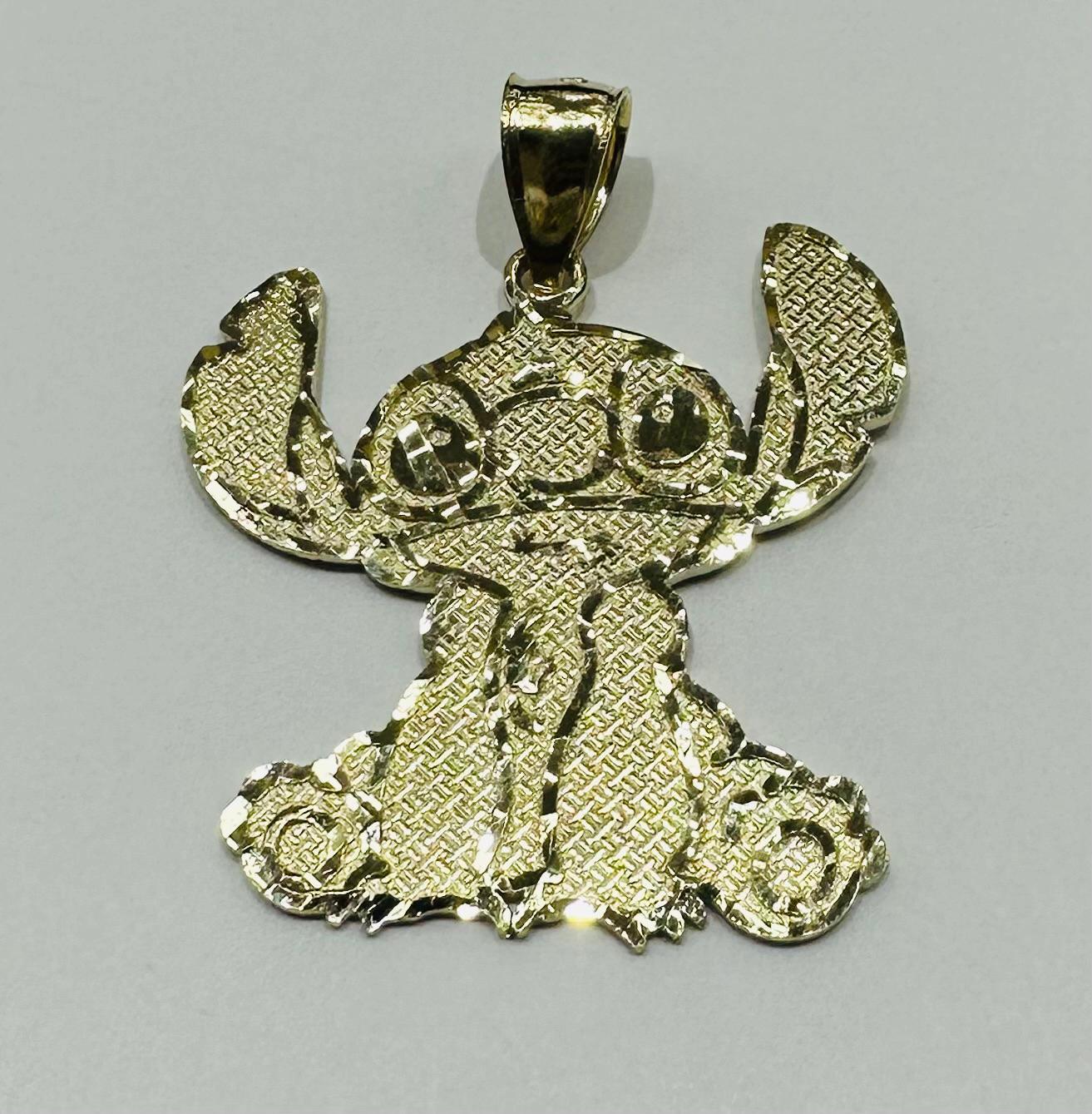 10K GOLD LARGE STICH PENDANT,  WEIGHT: 2.7gm