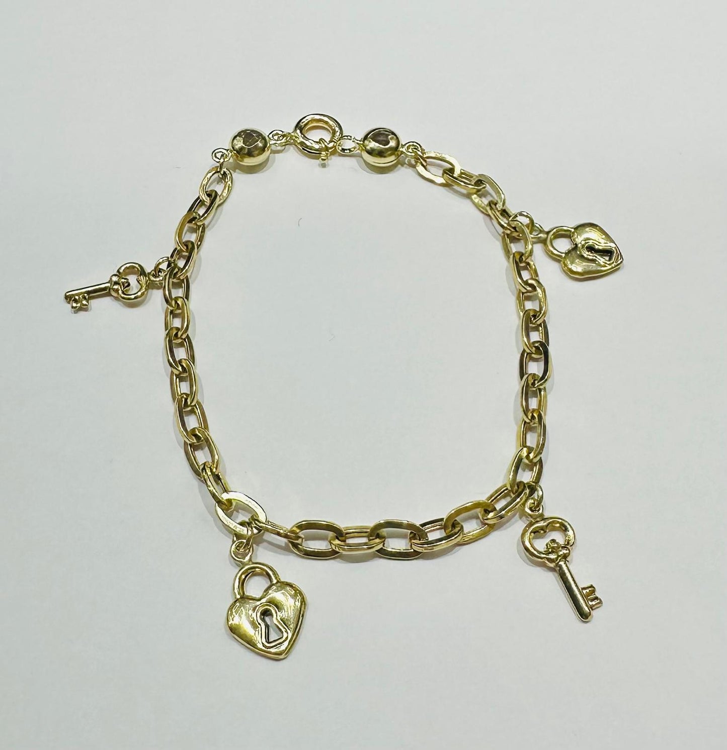 10K GOLD HEART LOCK AND KEY CHARMS OVAL LINK BRACELET 8" - 5.2gm