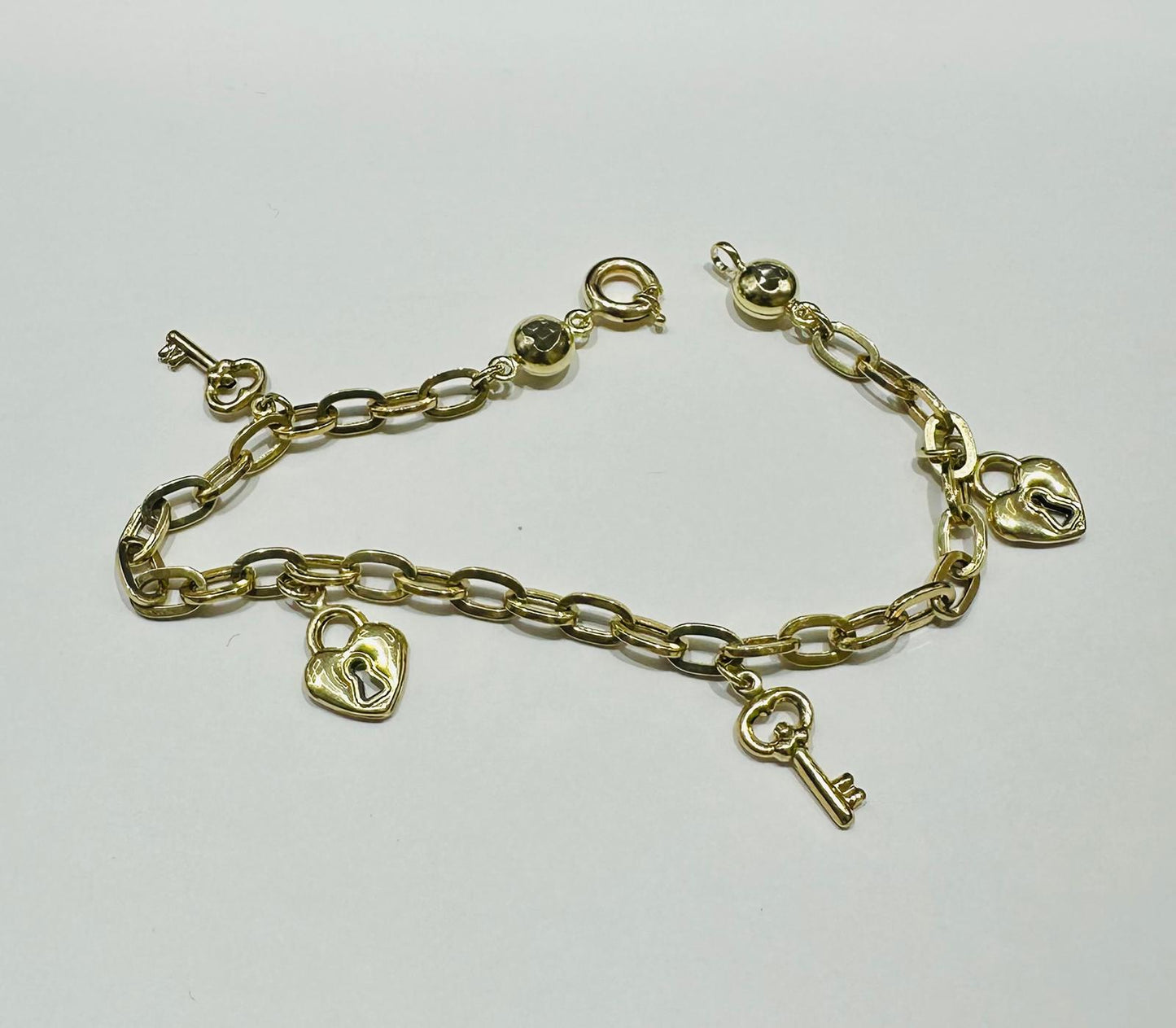 10K GOLD HEART LOCK AND KEY CHARMS OVAL LINK BRACELET 8" - 5.2gm