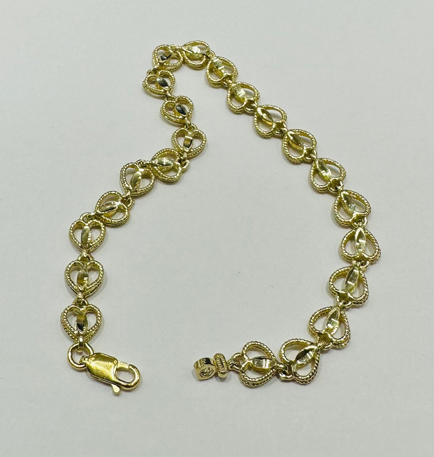 10K GOLD HEART BRACELET- WEIGHT: 7.4gm   7.5"