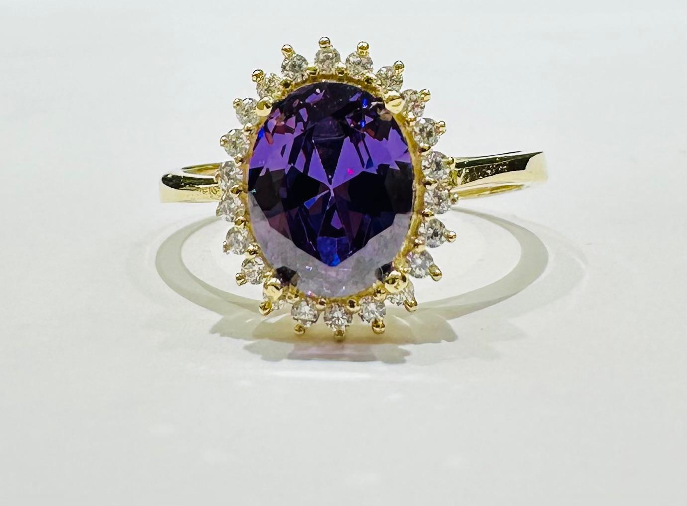 14K GOLD AMETHYST RING WITH CZ STONES- WEIGHT: 2.6gm