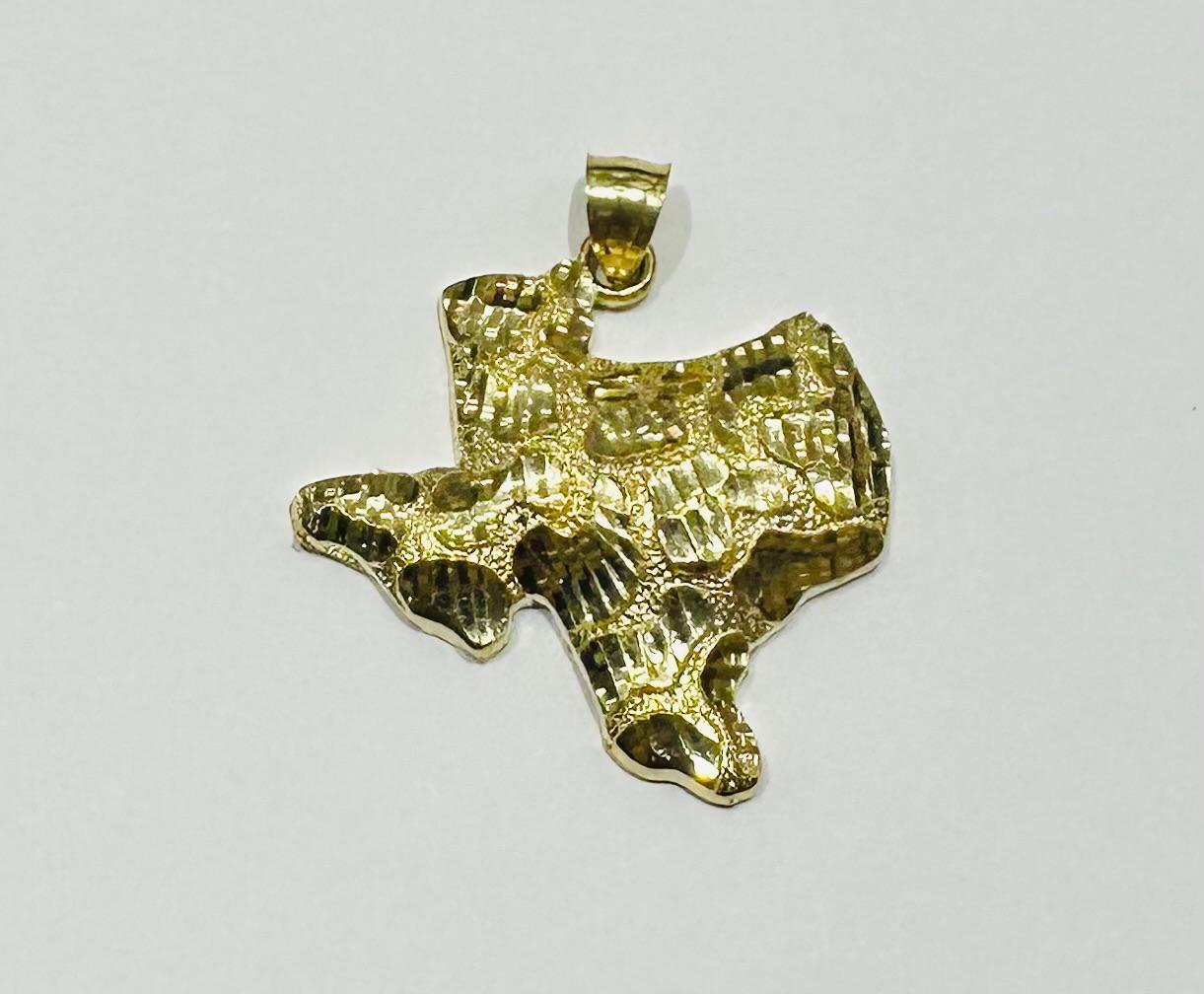 10K GOLD TEXAS NUGGET PENDANT-   WEIGHT: 5.6gm