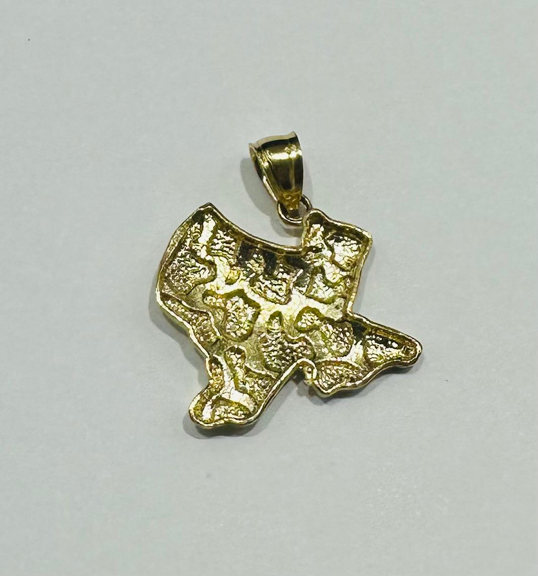 10K GOLD TEXAS NUGGET PENDANT-   WEIGHT: 1.7gm