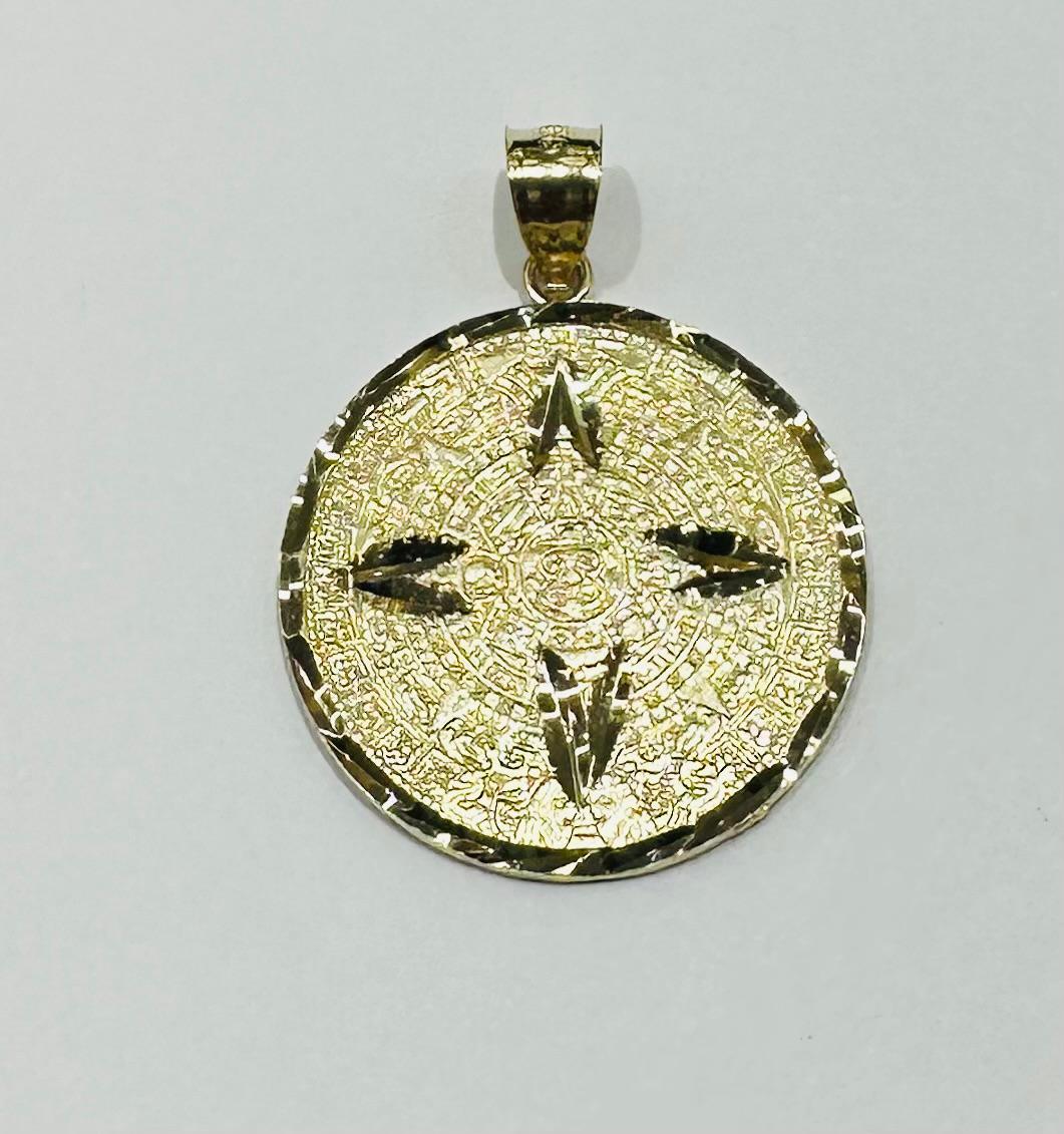 10K GOLD AZTEC CALENDER PENDANT-   WEIGHT: 2.5gm