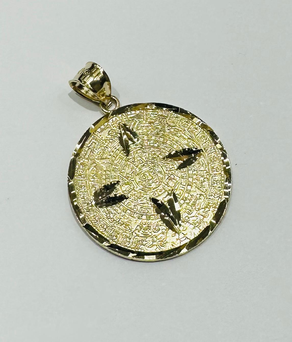 10K GOLD AZTEC CALENDER PENDANT-   WEIGHT: 2.5gm