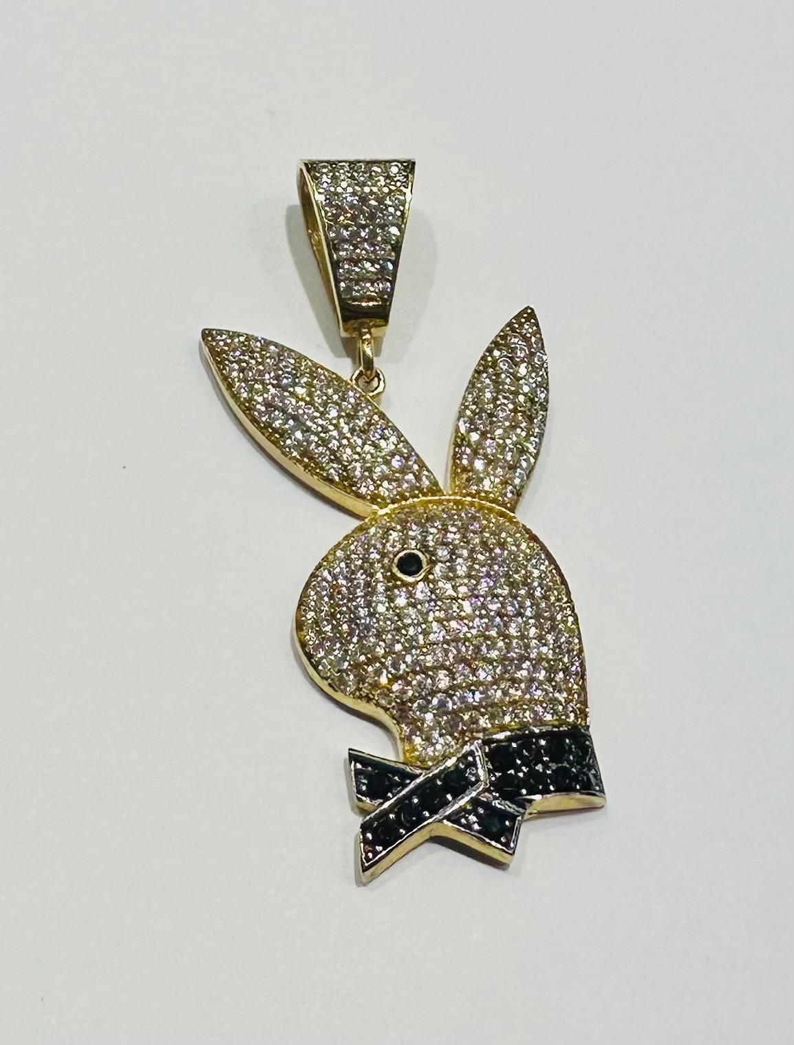 10K GOLD PLAYBOY PENDANT WITH WHITE SAPPHIRE- WEIGHT: 7.7gm