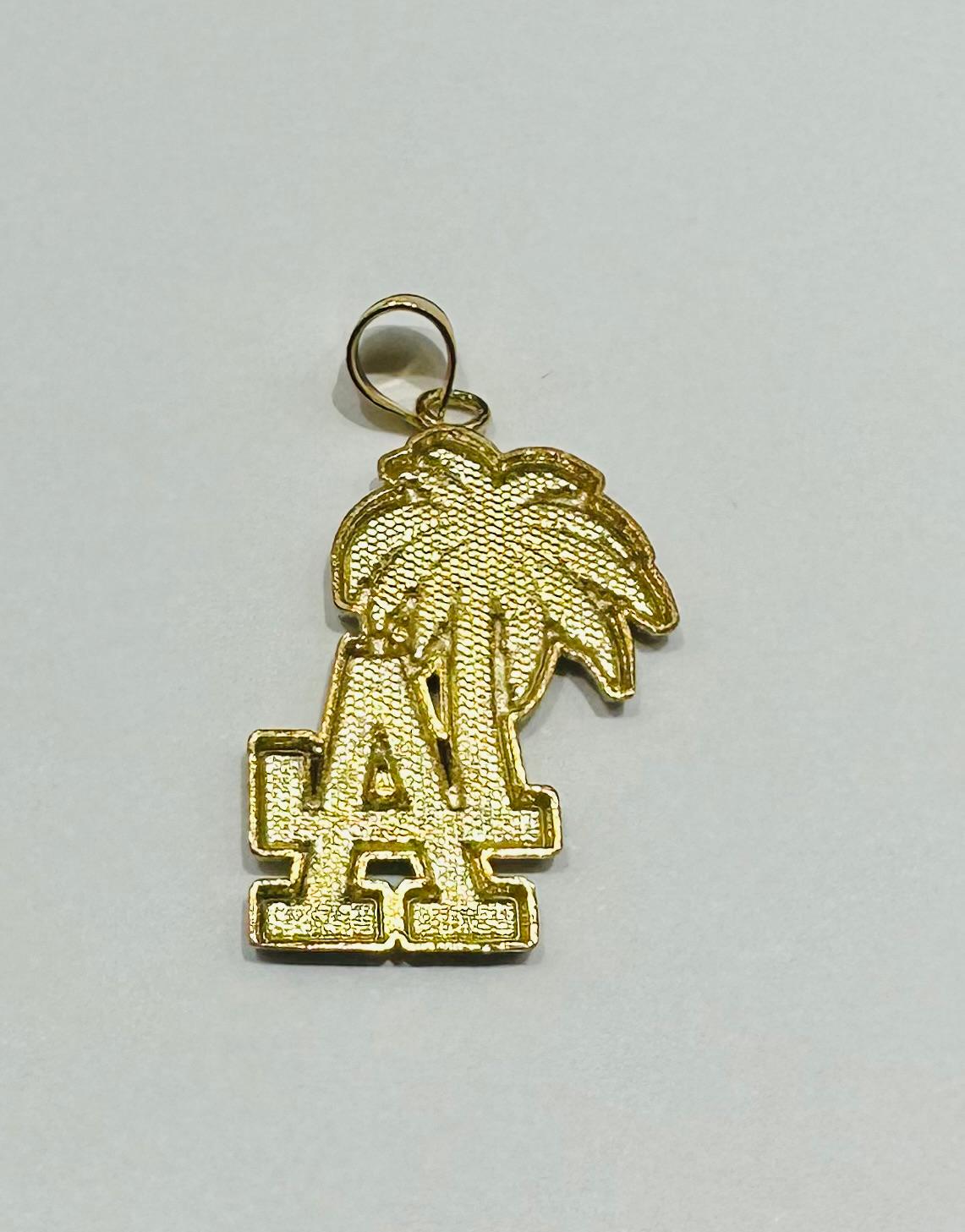 10K GOLD "LA" PENDANT- WEIGHT:  2.9gm