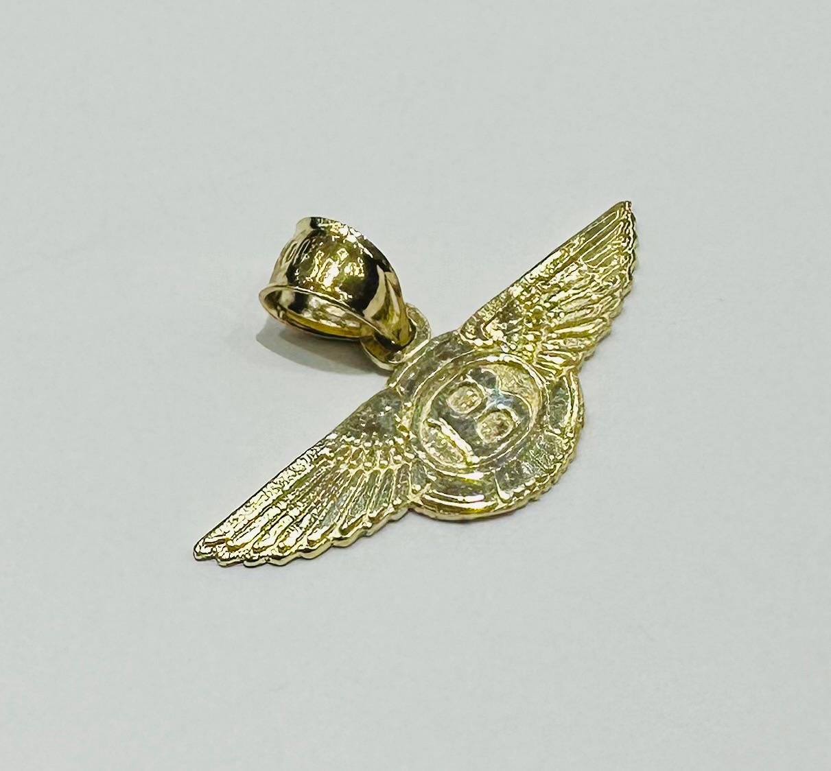 10K GOLD BENTLEY PEDANT- WEIGHT:  1.2gm