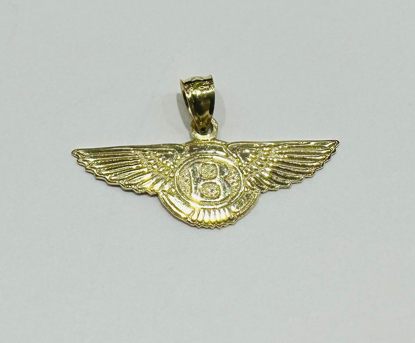 10K GOLD BENTLEY PEDANT- WEIGHT:  1.6gm