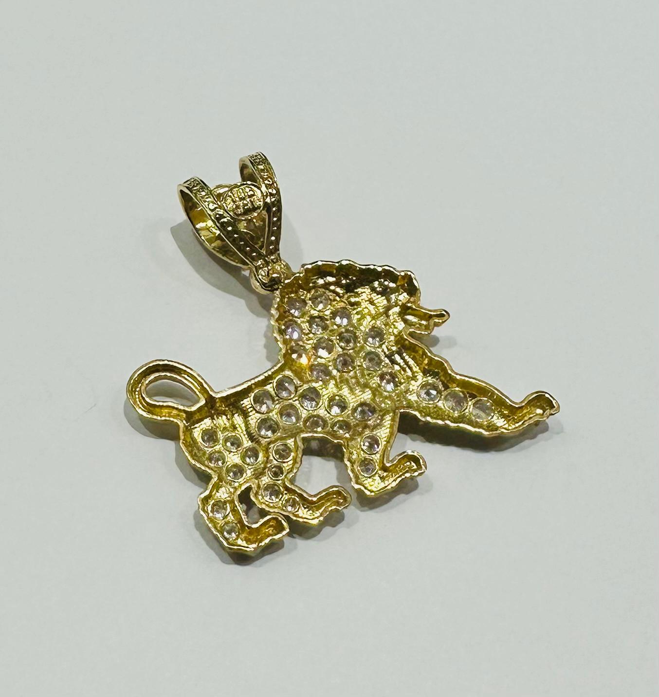 10K GOLD LION PENDANT WITH WHITE SAPPHIRE- WEIGHT:  5.1gm