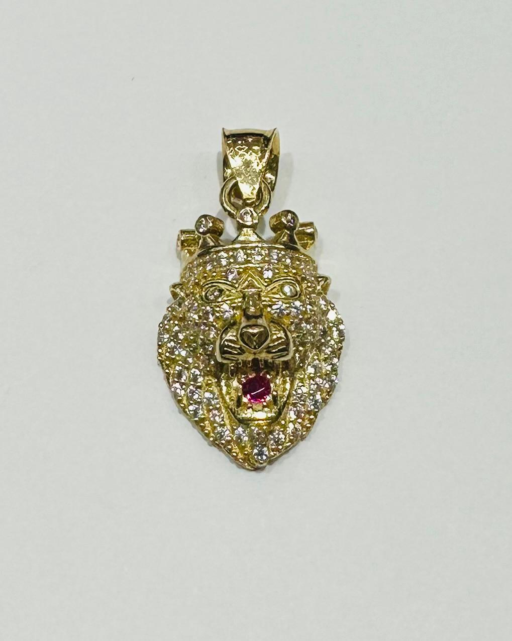 10K GOLD LION PENDANT WITH SAPPHIRE STONES- WEIGHT:  3.8gm