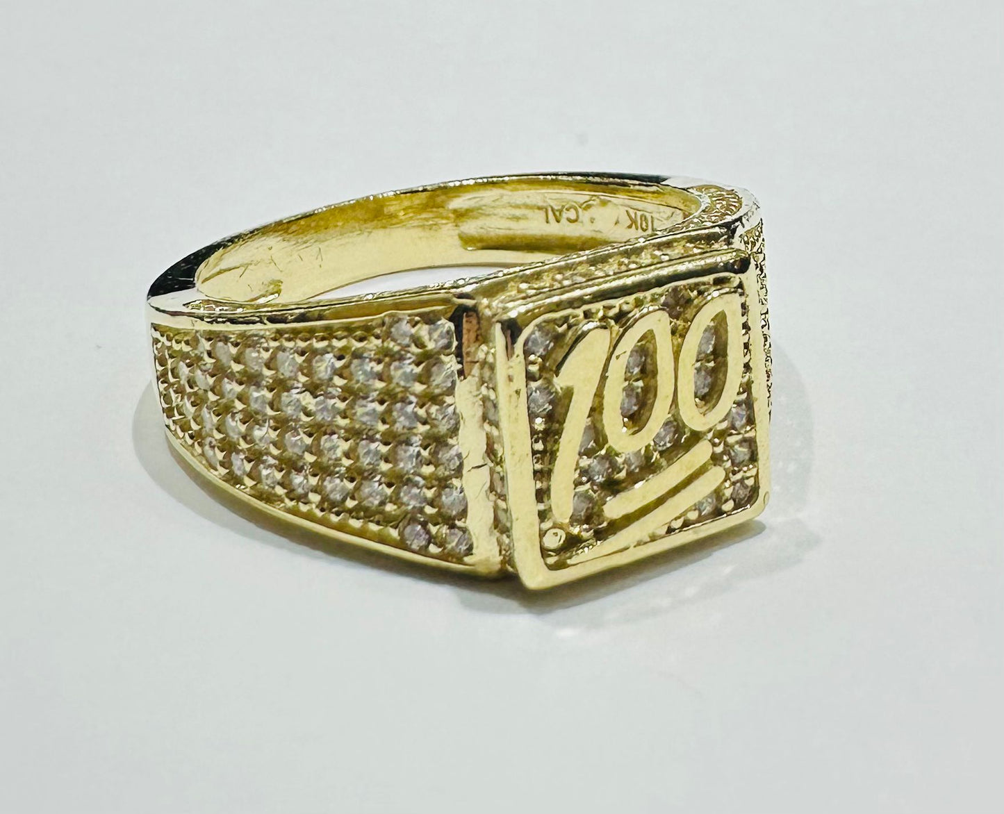 10K GOLD ONE HUNDRED SIGN RING WITH WHITE SAPPHIRE- WEIGHT: 6.7gm