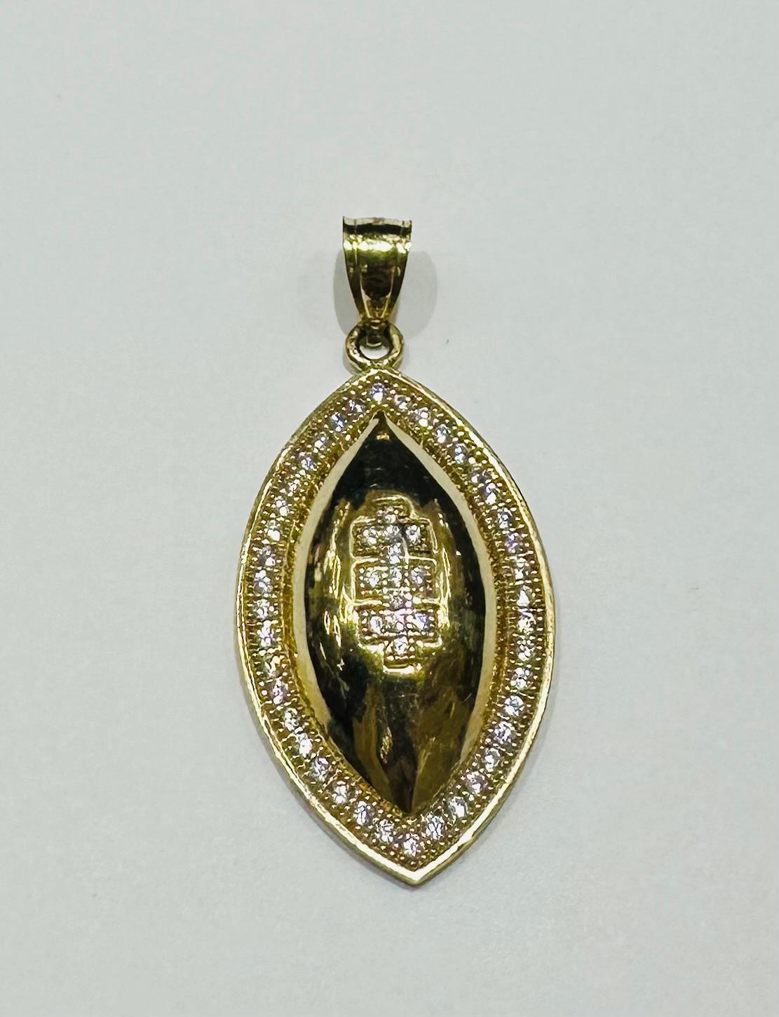 10K GOLD FOOTBALL PENDANT WITH WHITE SAPPHIRE- WEIGHT: 4.2gm