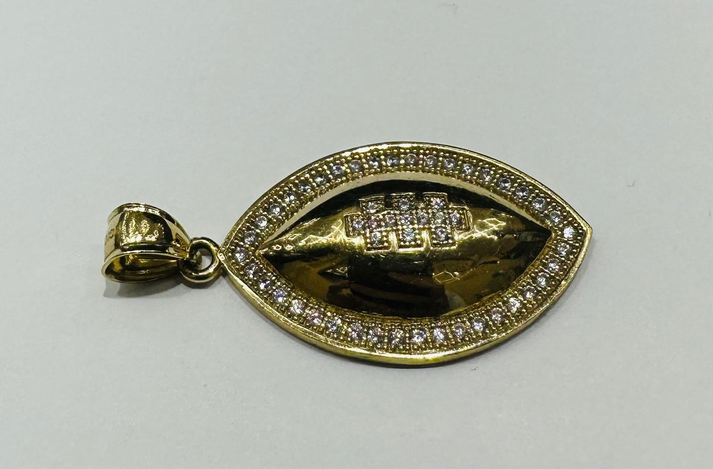 10K GOLD FOOTBALL PENDANT WITH WHITE SAPPHIRE- WEIGHT: 4.2gm