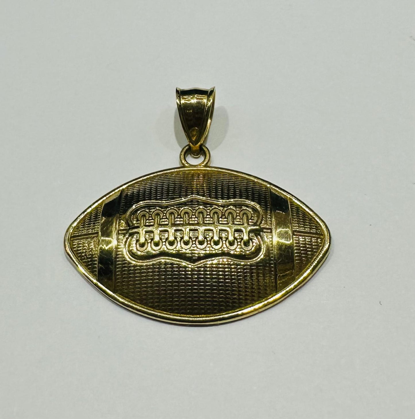 10K GOLD FOOTBALL PENDANT- WEIGHT: 3.7gm