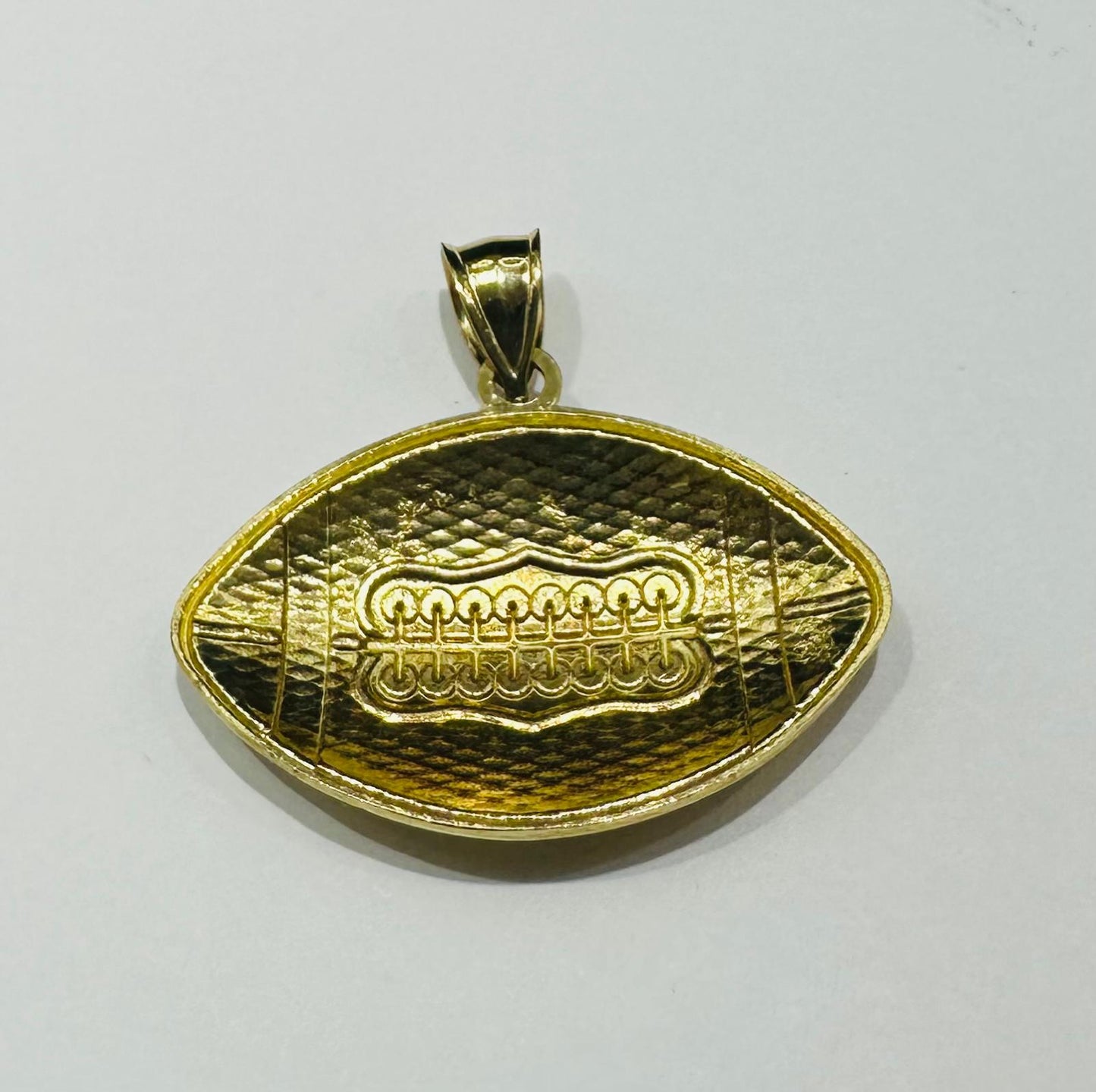 10K GOLD FOOTBALL PENDANT- WEIGHT: 3.7gm