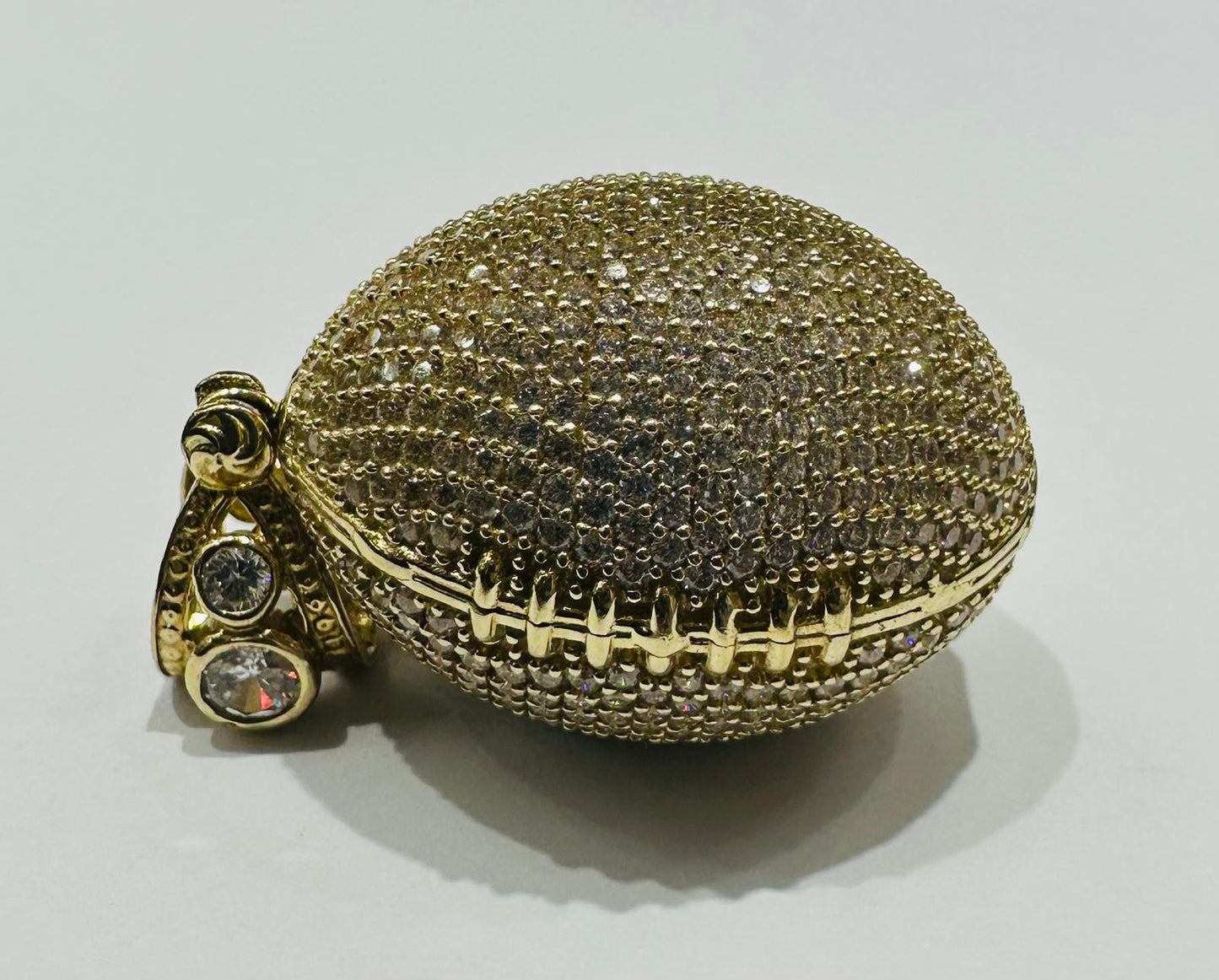 10K GOLD FOOTBALL PENDANT WITH WHITE SAPPHIRE-  WEIGHT: 15.3gm