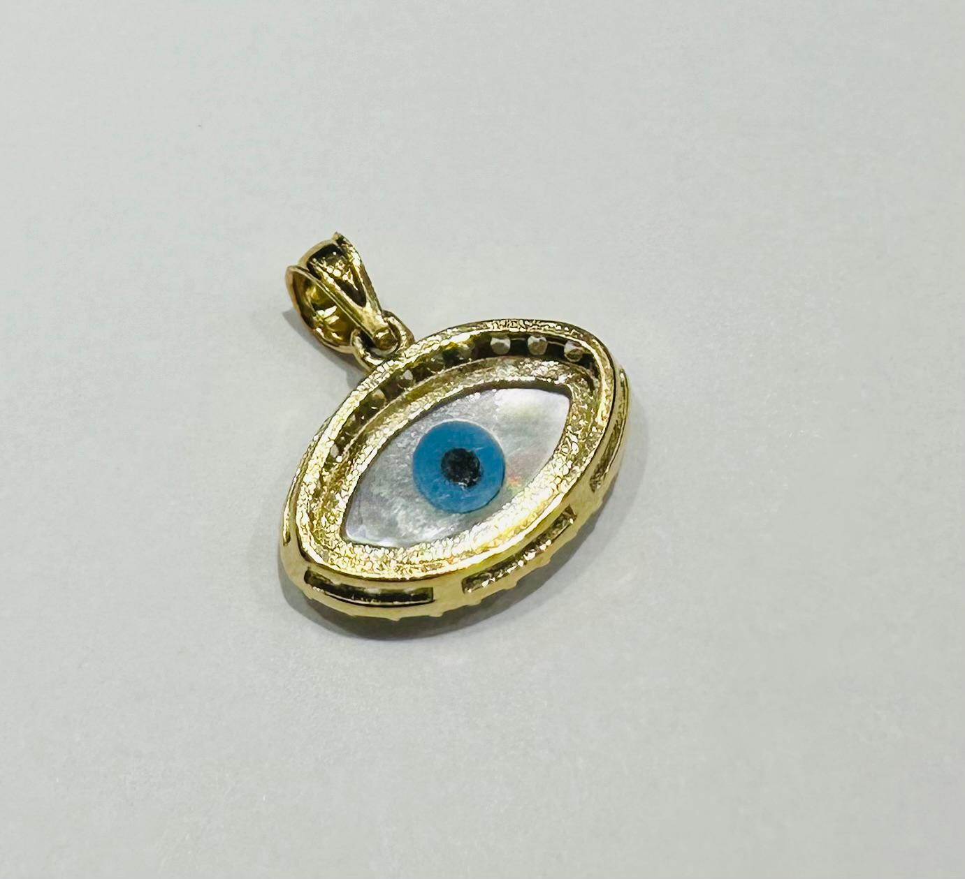 10K GOLD EVIL EYE PENDANT WITH WHITE SAPPHIRE- WEIGHT: 1.3gm