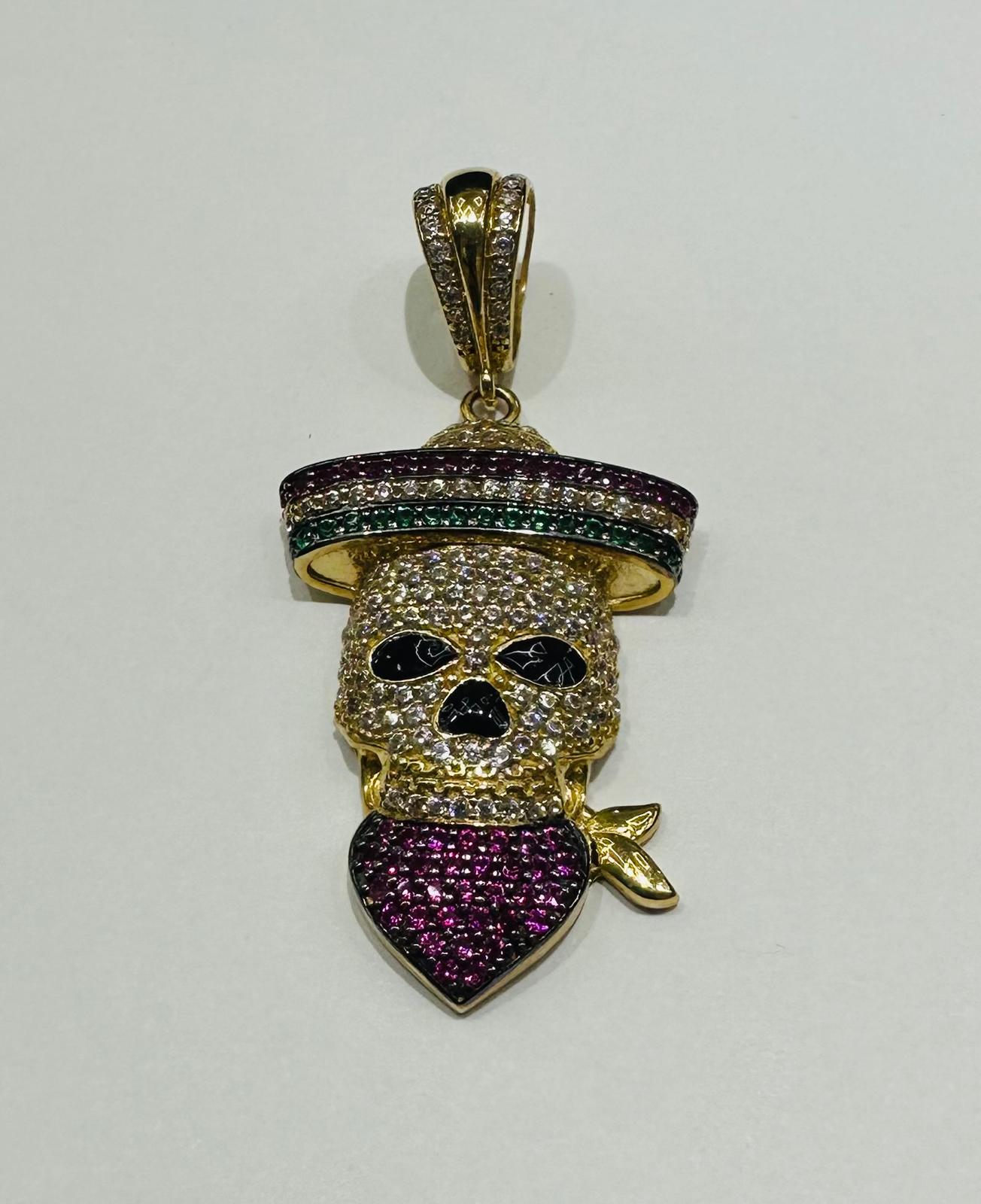 10K GOLD SKULL PENDANT WITH SAPPHIRE STONES- WEIGHT: 6.6gm