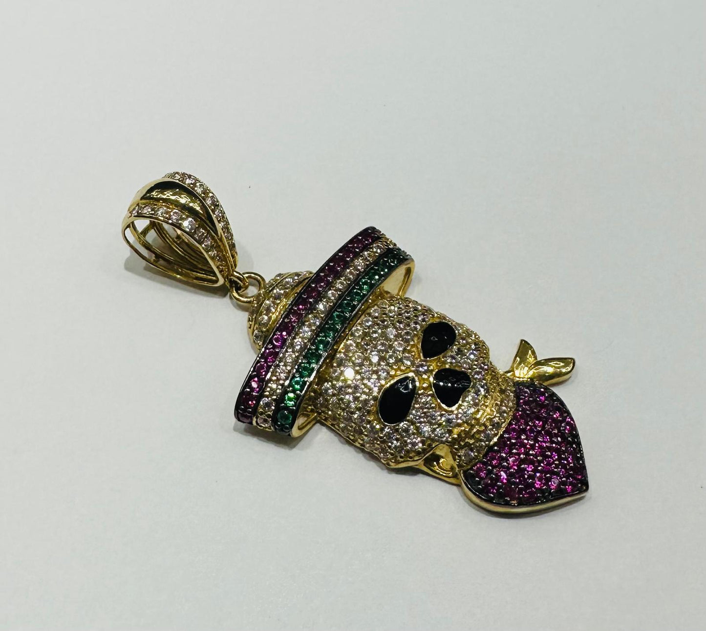 10K GOLD SKULL PENDANT WITH SAPPHIRE STONES- WEIGHT: 6.6gm