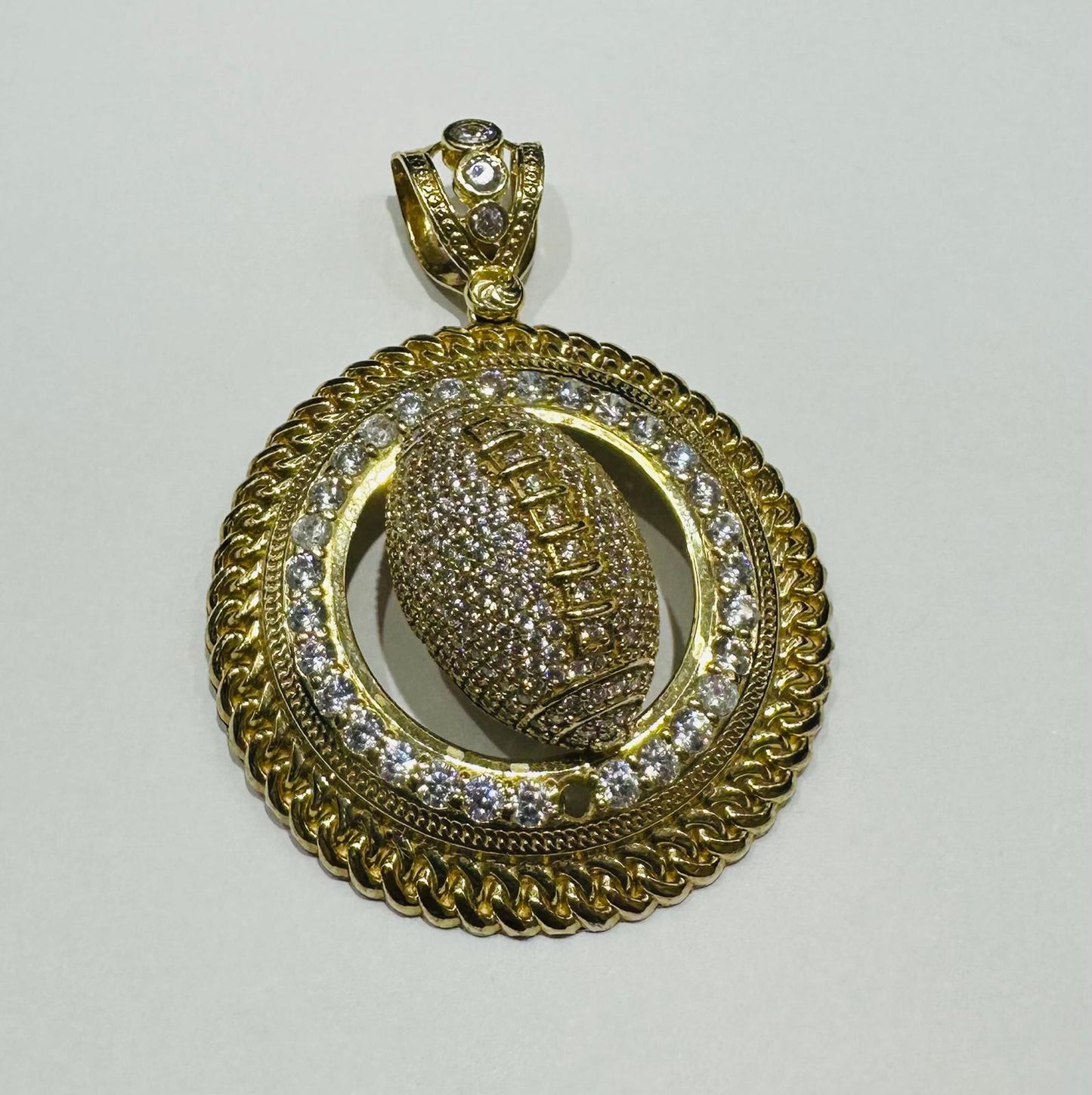 10K GOLD FOOTBALL PENDANT WITH WHITE SAPPHIRE- WEIGHT: 19.3gm