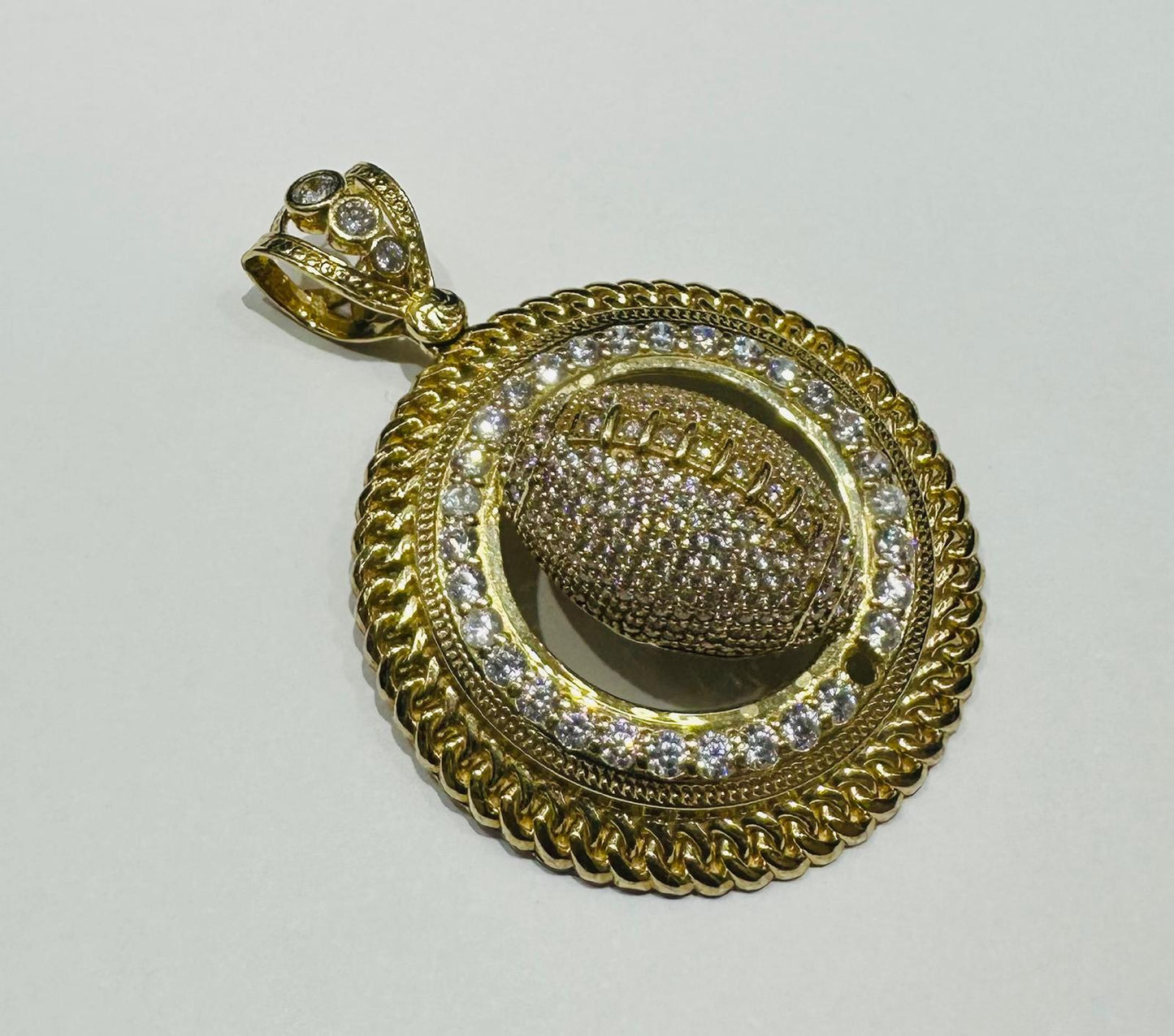 10K GOLD FOOTBALL PENDANT WITH WHITE SAPPHIRE- WEIGHT: 19.3gm
