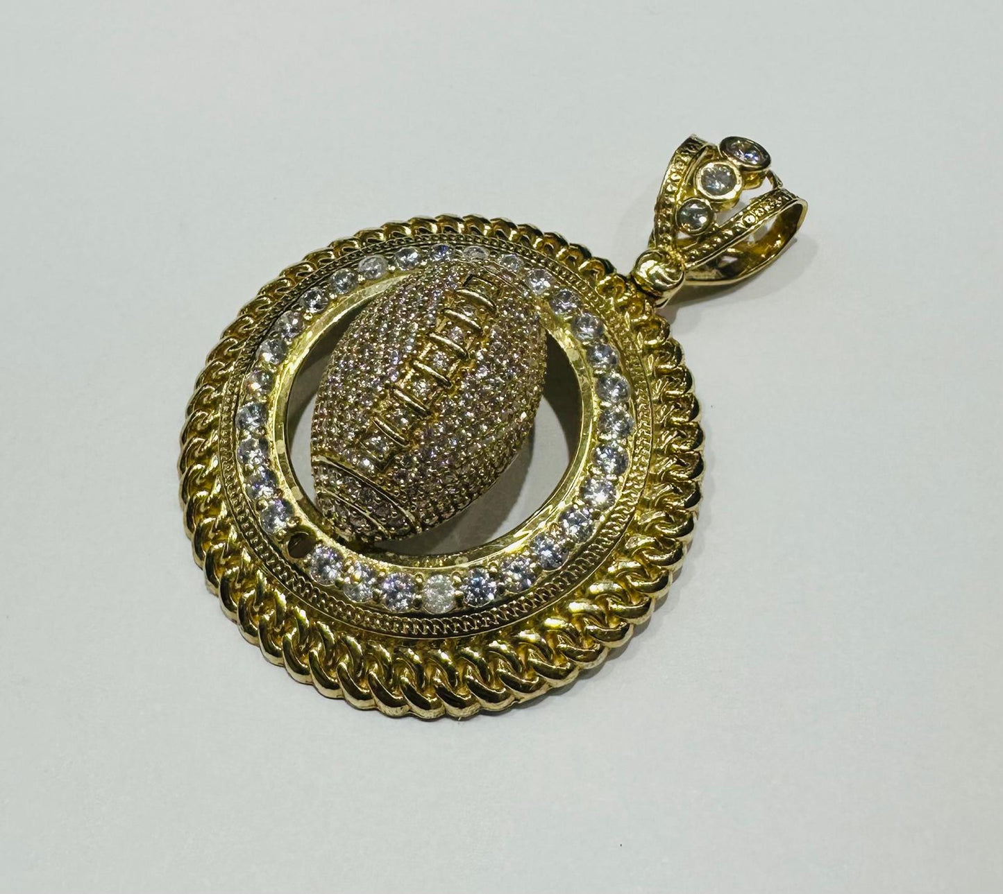10K GOLD FOOTBALL PENDANT WITH WHITE SAPPHIRE- WEIGHT: 19.3gm