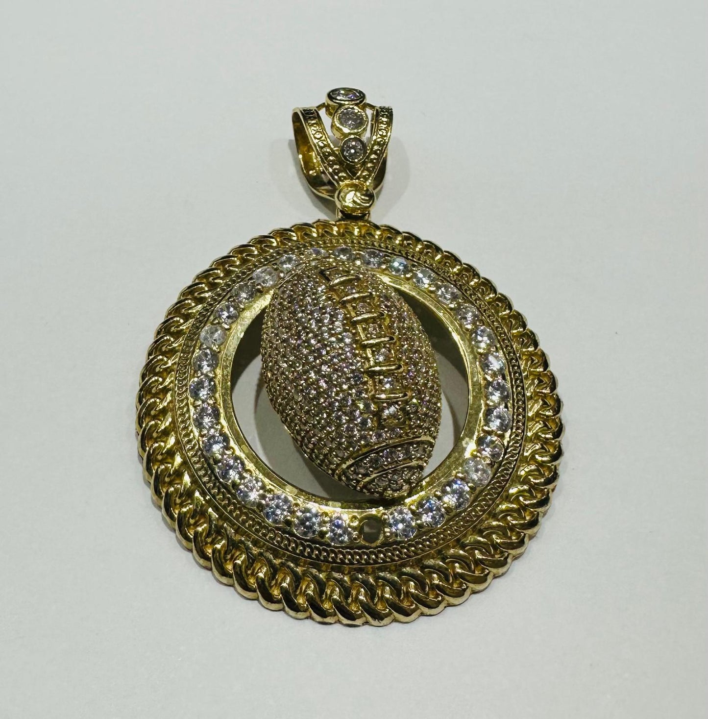 10K GOLD FOOTBALL PENDANT WITH WHITE SAPPHIRE- WEIGHT: 19.3gm