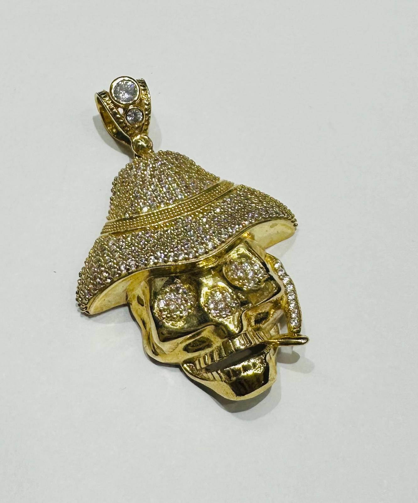 10K GOLD SKULL PENDANT WITH WHITE SAPPHIRE- WEIGHT: 13.1gm