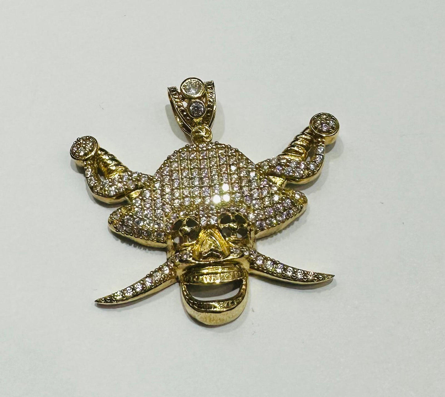 10K GOLD SKULL PENDANT WITH WHITE SAPPHIRE- WEIGHT: 7.5gm