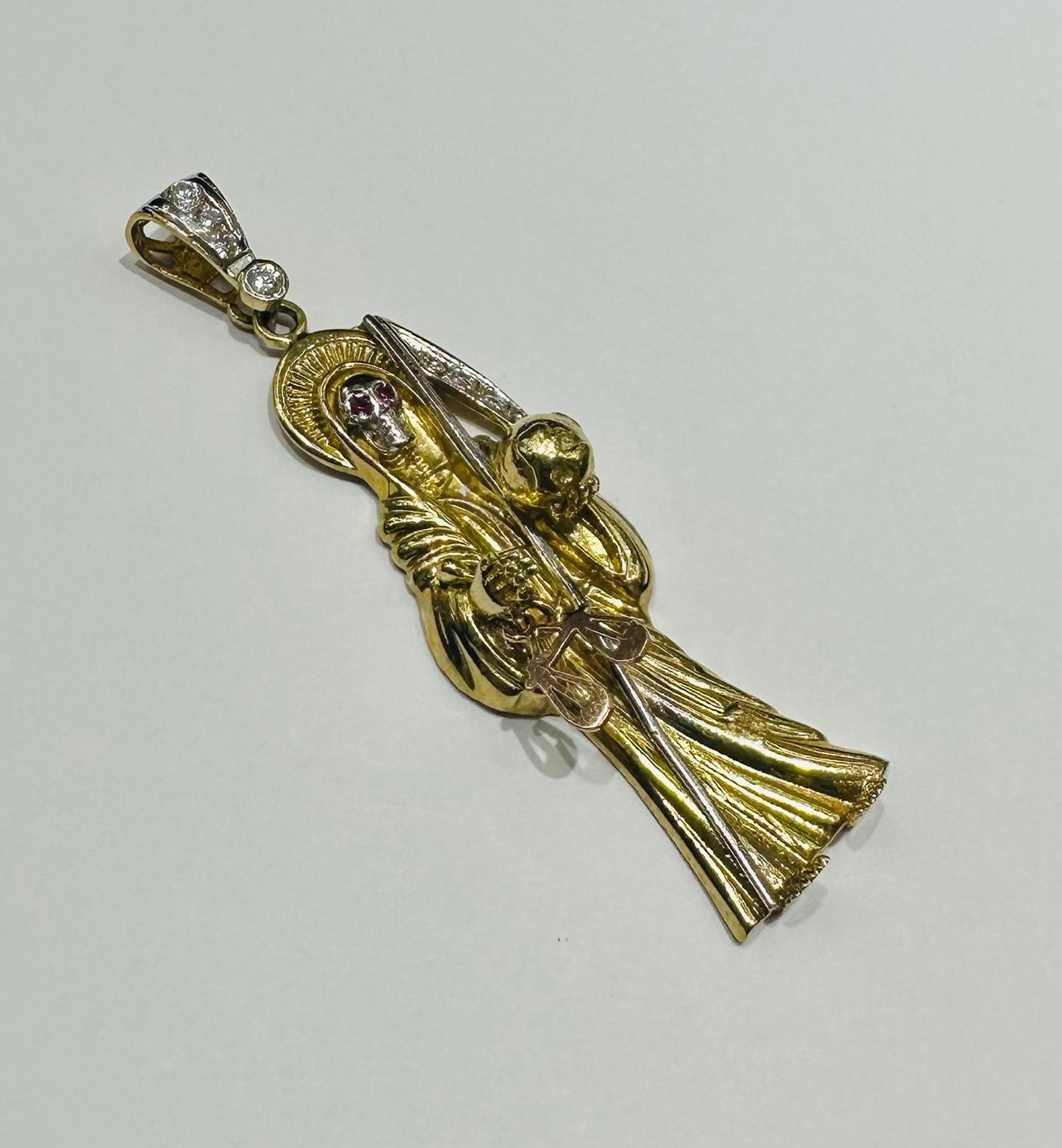 10K GOLD SANTA MUERTE PENDANT WITH SAPPHIRE STONES- WEIGHT: 13.6gm