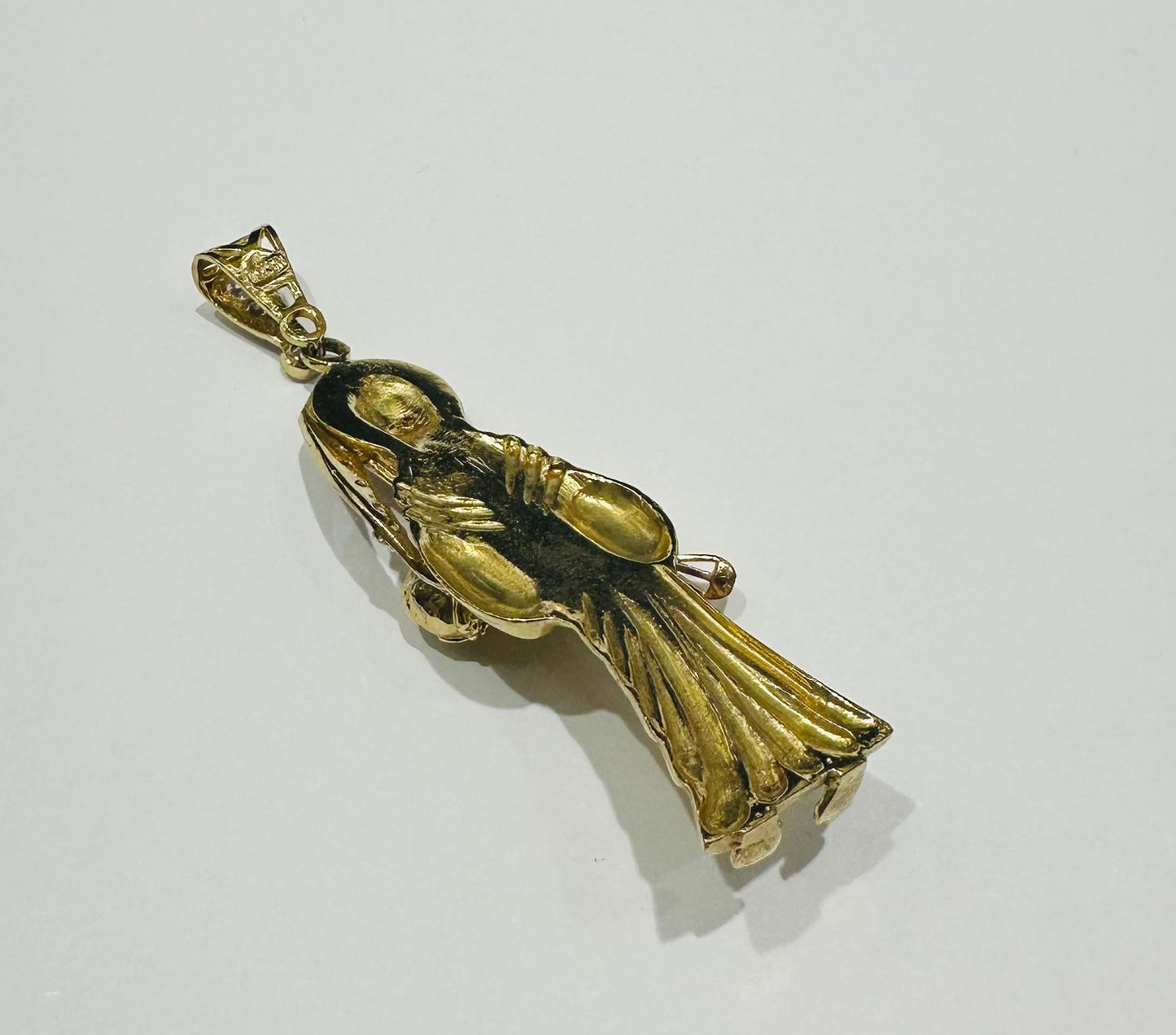 10K GOLD SANTA MUERTE PENDANT WITH SAPPHIRE STONES- WEIGHT: 13.6gm